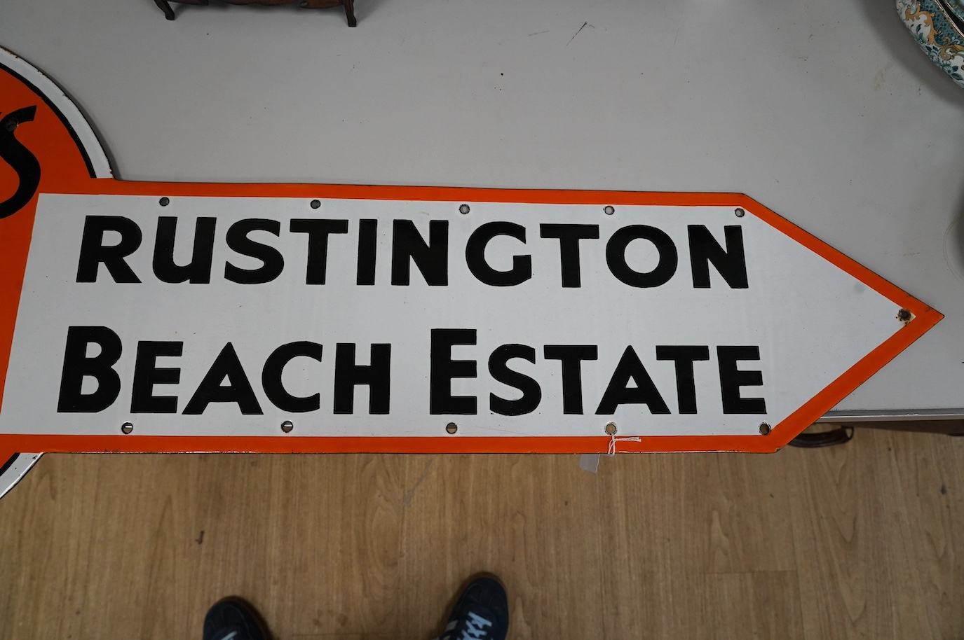 A 1930s Tuckers Agents Rustington Beach Estate enamel sign, 118cm. Condition - fair, wear to edges.